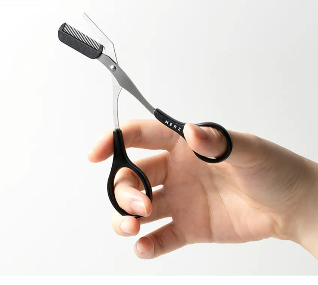 Pink eyebrow trimming scissors